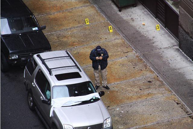 Photograph of an investigator at the crime scene on East 19th, just east of Broadway, by Global Voyager on Flickr